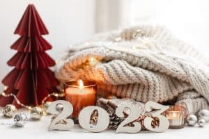 Christmas background with decorative numbers 2023 and cozy details.