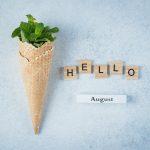 Ice cream waffle cone with mint leaves. Summer card concept. Hello August Top view, flat lay