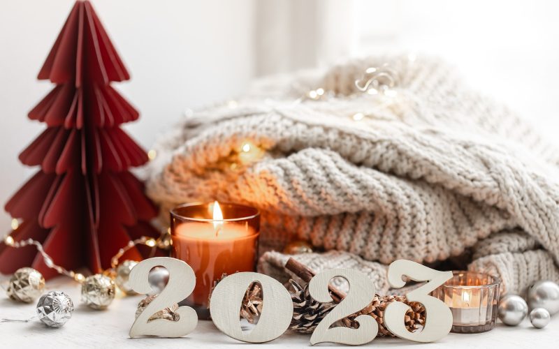Christmas background with decorative numbers 2023 and cozy details.